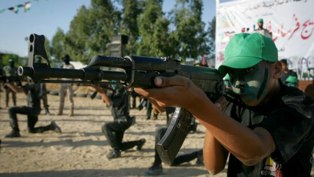 Palestinian youths participate in a graduation ceremony of a military-style camp organized by the Hamas terror group in Gaza on Aug. 18, 2017. Credit: Abed Rahim Khatib/Flash90.