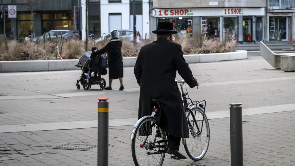 A Jewish man cycles in in Antwerp, Belgium, on Jan. 21, 2021. Photo by Dirk Waem/BELGA MAG/AFP via Getty Images.