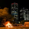 A car is lit on fire in Tel Aviv during a protest over the June 30 shooting death of 19-year-old Ethiopian Solomon Tekah in Kiryat Haim, July 2, 2019. Photo by Flash90.