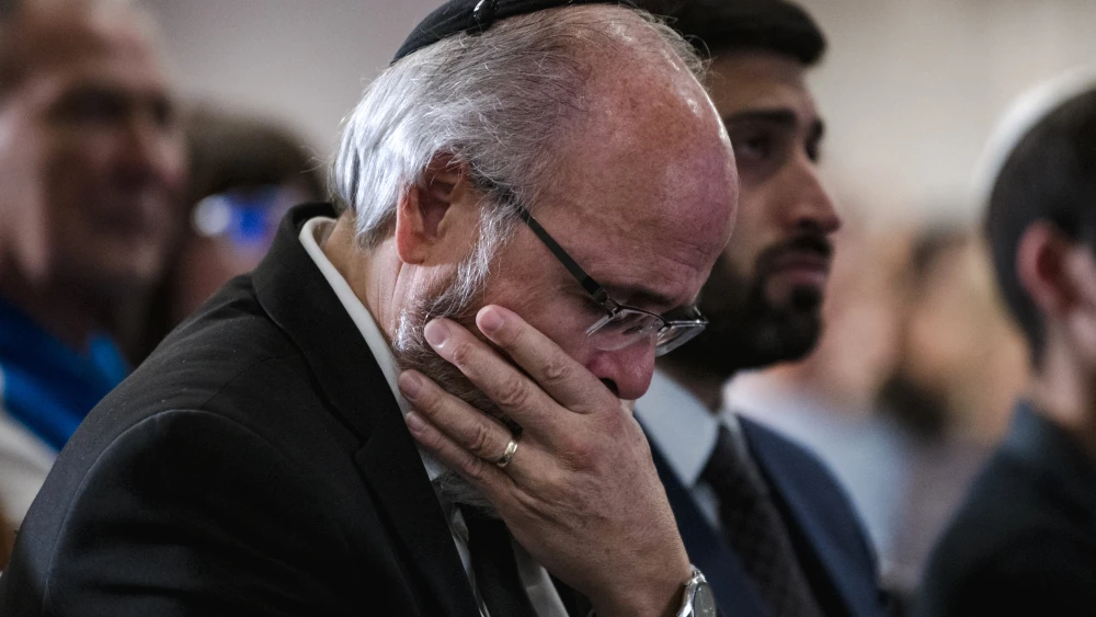 Members of Montreal’s Jewish community gather for a vigil at the Gelber Conference Centre in Canada on Oct. 9, 2023, after Hamas terrorists from Gaza invaded and massacred 1,200 people in southern Israel on Oct. 7. Photo by Andrej Ivanov/AFP via Getty Images.