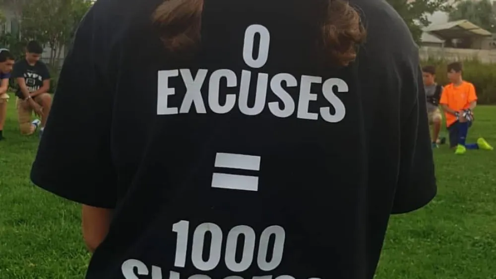 An Israeli girl displays one of the “Young Champions” T-shirts. Credit: Courtesy.