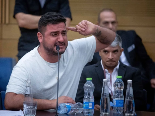 A man cries during an emergency meeting of the lobby for aid to IDF veterans with PTSD and their families at the Knesset in Jerusalem on Aug. 8, 2023. Photo by Oren Ben Hakoon/Flash90.