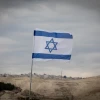 View of the Israeli flag and the area known as E1 on Jan. 2, 2017. Photo by Yonatan Sindel/Flash90.