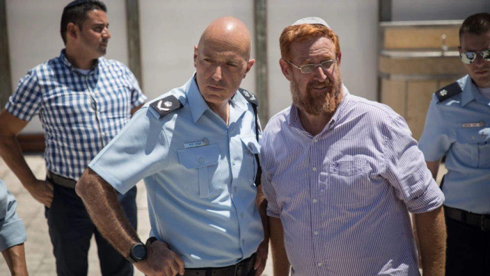 Jerusalem District Police Commander Doron Yedid with Temple Mount activist and former Knesset member Yehuda Glick at the Western Wall Plaza near the Mughrabi Bridge in the Old City of Jerusalem after clashes broke out on the Temple Mount and around its gates on Aug. 11, 2019. Photo by Hadas Parush/Flash90.
