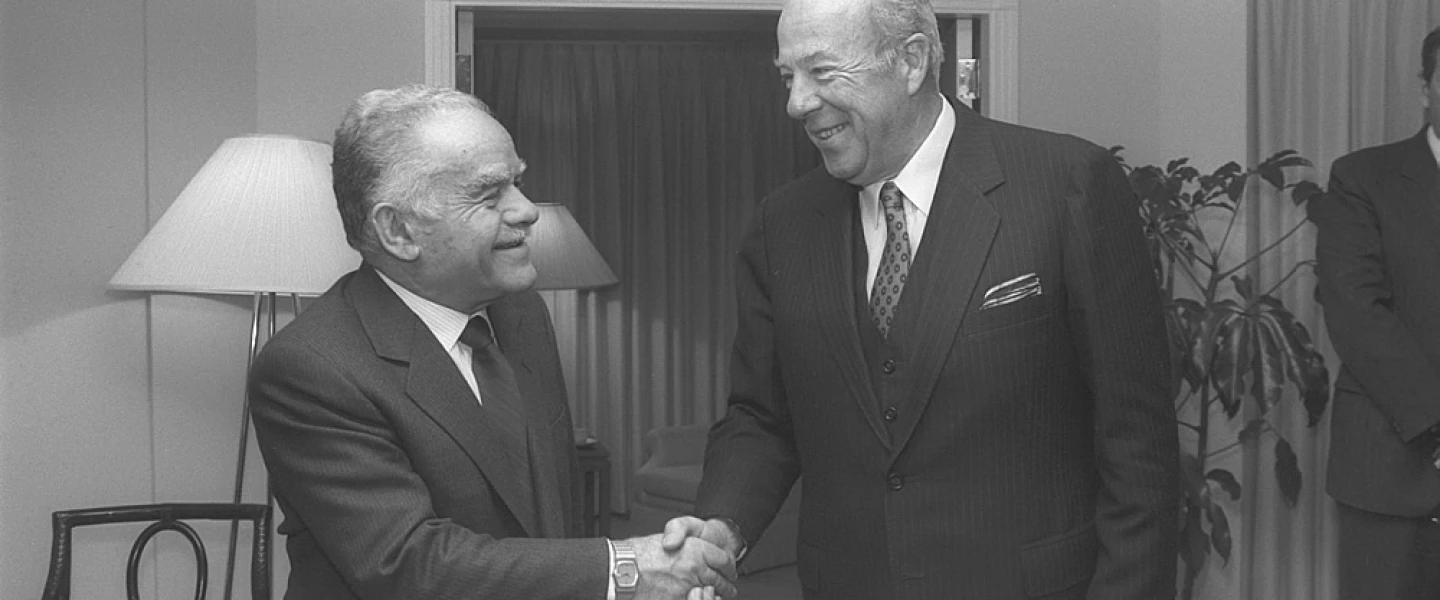 Israeli Prime Minister Yitzhak Shamir greets longtime friend of the Jewish state George Shultz, one of two men to have served in four different U.S. cabinet positions. Credit: Herman Chanania/GPO.
