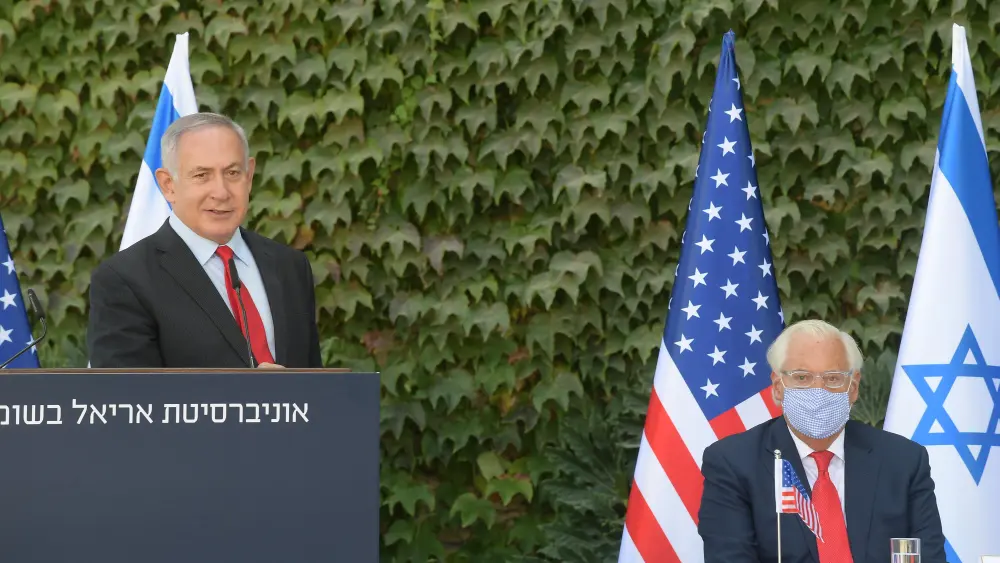 Israeli Prime Minister Benjamin Netanyahu delivering remarks at Ariel University, along with U.S. Ambassador to Israel David Friedman. Credit: Amos Ben-Gershom/GPO.