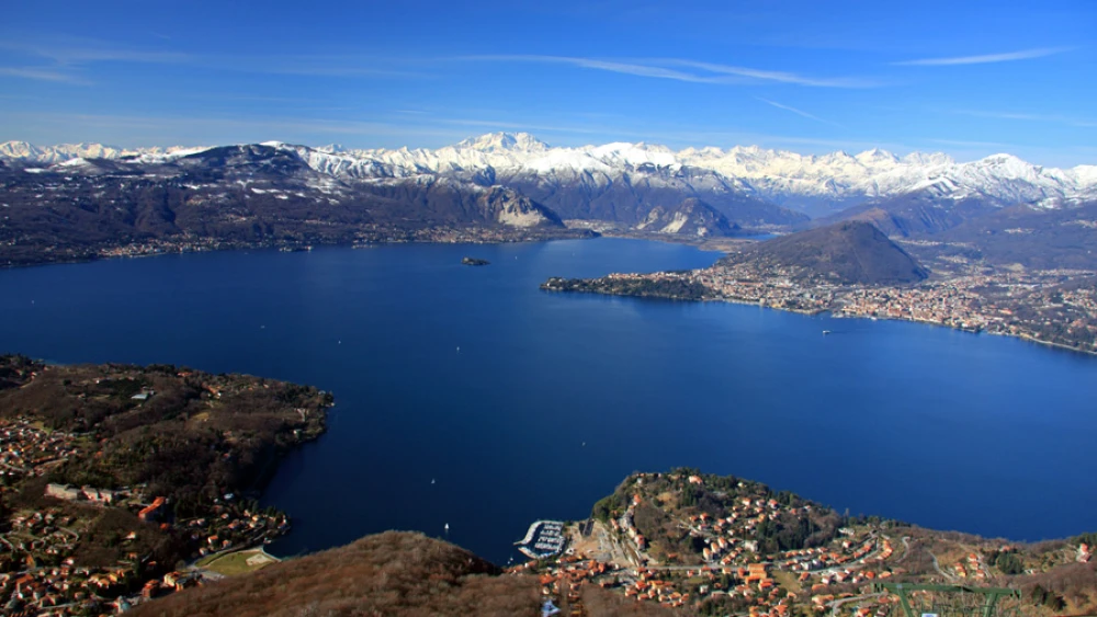 Lake Maggiore with the Alps in the background. Photo by Alessandro Vecchi via Wikimedia Commons.