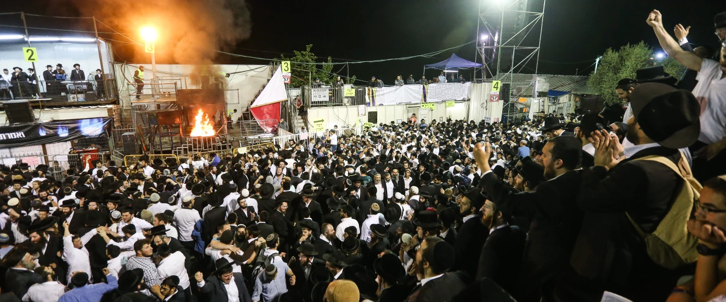 Haredi men take part in the celebration of the Jewish holiday of Lag B’Omer on Mount Meron in northern Israel. May 7, 2015. Credit: Meir Vaknin/Flash90