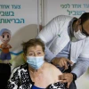 Holocaust survivor Shimon Mira gets a COVID-19 vaccine at a vaccination center in Jerusalem on Jan. 6, 2021. Photo by Yonatan Sindel/Flash90.