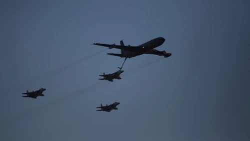 An Israeli KC-135 Stratotanker Boeing 707 plane refuels an F-15 fighter jet as they take part in an air show for a graduation ceremony at the Hatzerim base in the Negev desert, near the southern Israeli city of Beersheva on Dec. 31, 2015. Photo by Lior Mizrahi/Flash90.