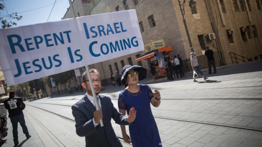Christian missionaries march on Jaffa Road with a sign saying “Repent Israel, Jesus Is Coming” in central Jerusalem on Oct. 5, 2016. Photo by Hadas Parush/Flash90.