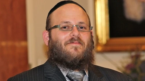 Click photo to download. Caption: Rabbi Menachem Stern, pictured, was sworn in as a U.S. army chaplain in December 2011 following the resolution of his lawsuit against the army over its "no-beard" policy. Credit: Chabad.org.
