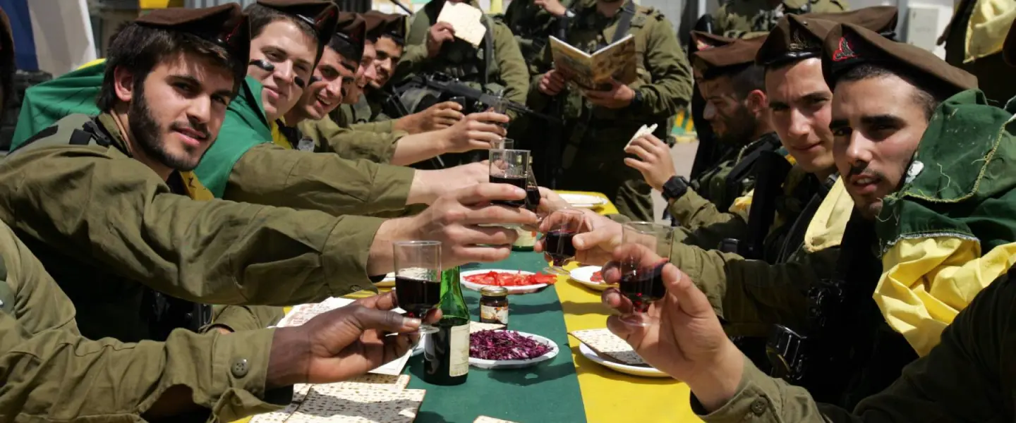Israeli soldiers of the Golani Brigade eat a Passover meal. Credit: Edi Israel/Flash90.