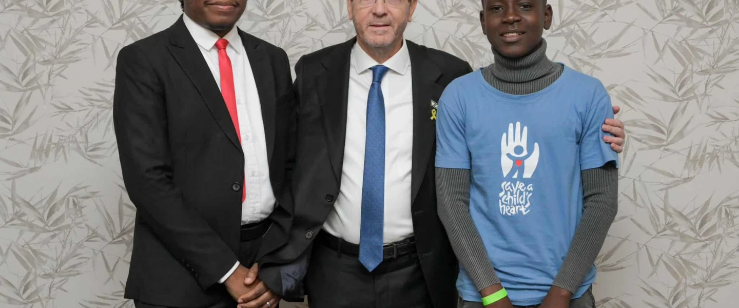 Dr. Kalembe Lwara, Israeli President Isaac Herzog, and a past patient of Save a Child's Heart, Kachese Syapiila, in Lusaka on November 10, 2025. Photo by Maayan Toaf/GPO.