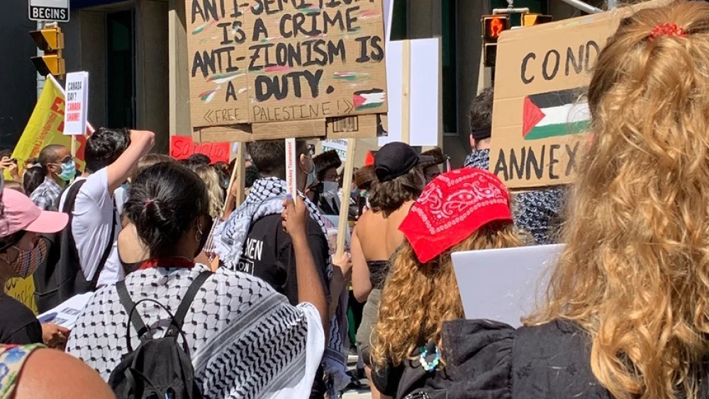 Pro-Palestinian activists, supported by a wide array of leftist and Marxist organizations, including those associated with Black Lives Matter, hold a "Day of Rage" protest against Israel's planned extension of its sovereignty to the Jordan Valley and parts of Judea and Samaria, outside the Israeli consulate in Toronto. Credit: TheJ.ca.