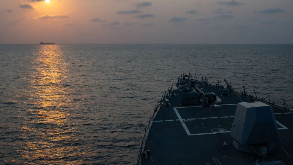 Guided-missile destroyer USS Pinckney (DDG 91) observes a merchant vessel while on patrol enforcing the U.S. blockade against Iran, May 4, 2026. Credit: U.S. Central Command.