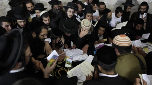 Jewish men pray at Joseph’s Tomb in Shechem/Nablus on July 4, 2011. Believed to be the final resting place of the biblical patriach Joseph, the area continually draws worshippers, who are often met by violence. Photo by Yaakov Naumi/Flash90.