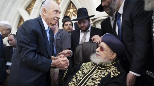 Click photo to download. Caption: Shas spiritual leader Rabbi Ovadia Yosef shakes hands with Israeli President Shimon Peres at a Sept. 16 ceremony at the Rabban Yohanan Ben Zakai Synagogue in Jerusalem during which his son, Rabbi Yitzhak Yosef, officially became the Sephardi Chief Rabbi of Israel. Photo by Yonatan Sindel/Flash90.