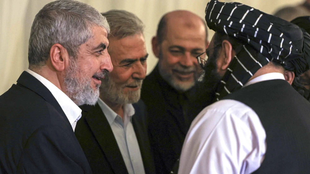 Hamas senior official Khaled Meshaal (left) and Ziyad al-Nakhalah (second from left), secretary-general of the Palestinian Islamic Jihad movement, at the funeral of Hamas political leader Ismail Haniyeh (who was assassinated in Tehran on July 31) in the Qatari capital of Doha, Aug. 2, 2024. Photo by Mahmud Hams/AFP via Getty Images.
