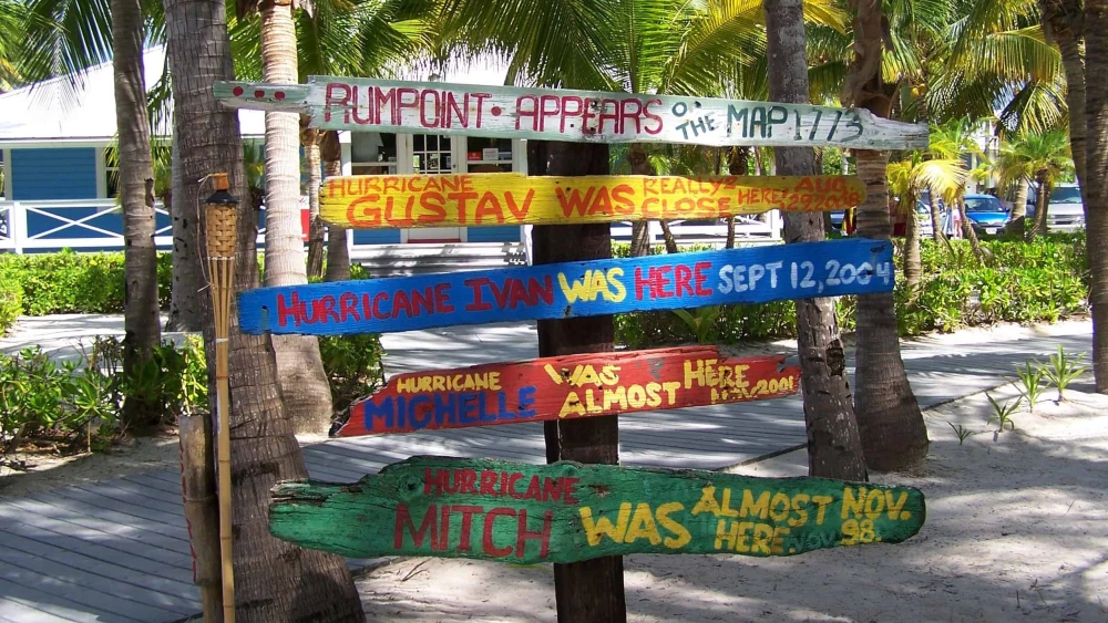 Signs denoting past hurricanes at Rum Point, Grand Cayman Island. Credit: Lhb1239 via Wikimedia Commons.