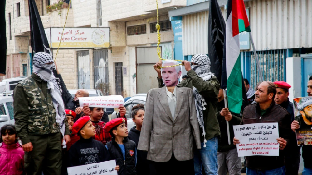 Palestinians hang dolls bearing the portrait of U.S. Vice President Mike Pence and U.S. President Donald Trump during a protest in the West Bank city of Bethlehem on Jan. 27, 2018. Photo by Wisam Hashlamoun/Flash90.