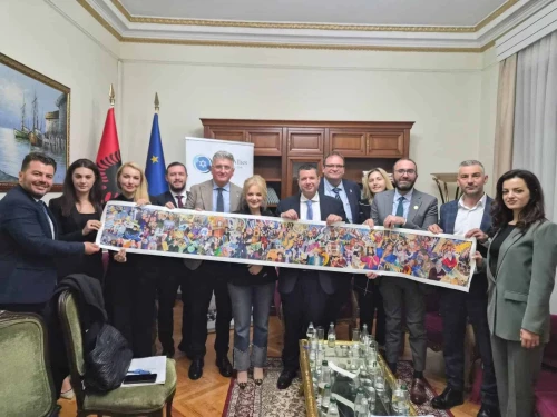 Members of the new Albanian Israel Allies Caucus hold a painting depicting the history of the Jewish people at their inaugural meeting in parliament on Monday. Credit: Courtesy Israel Allies Foundation, November 10. 2025.