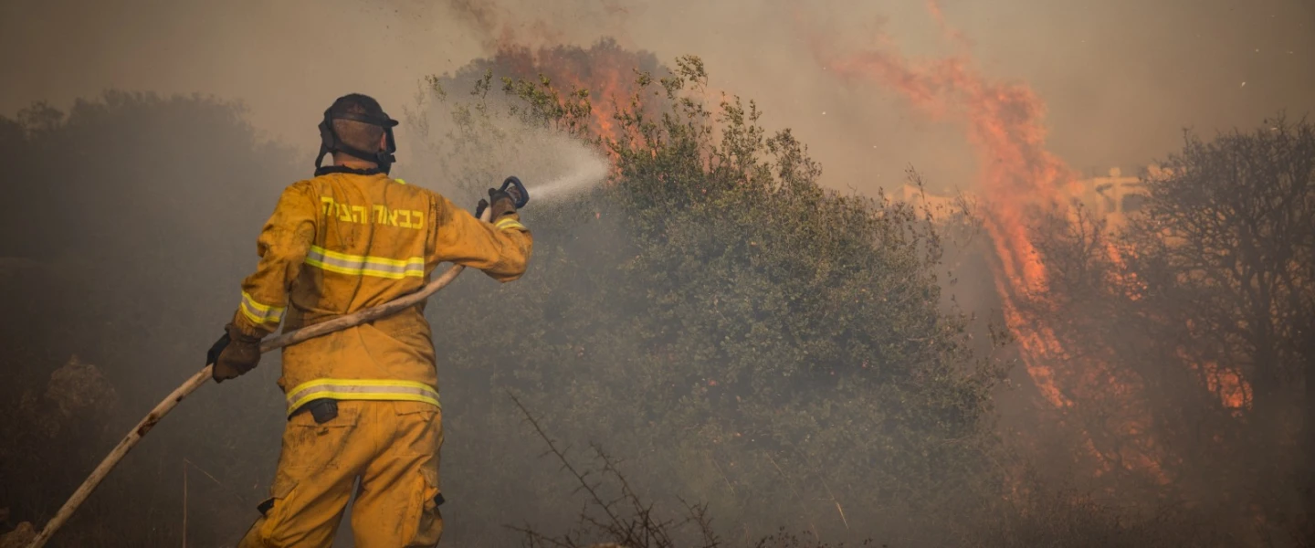 Firefighters extinguishing a forest fire near Jerusalem in November 2019. Photo by Noam Revkin Fenton/Flash90.