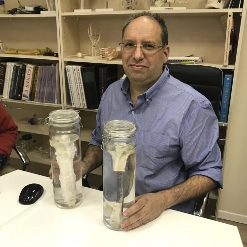 Dr. Shai Meretzki, CEO of Bonus BioGroup, with a lab-grown bone. Credit: Bonus BioGroup.