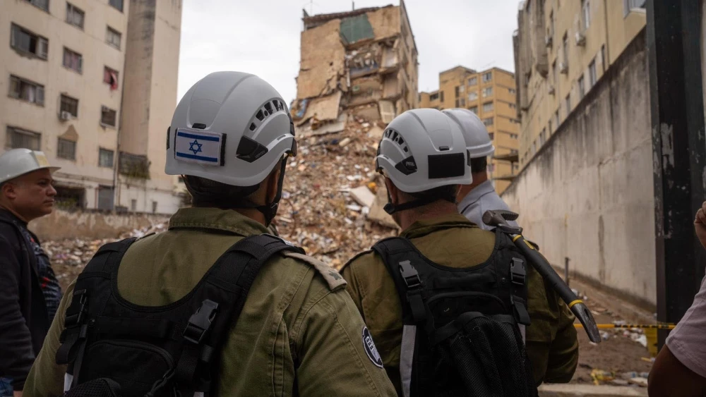 Israeli Home Front Command personnel survey a collapsed residential building while conducting structural assessments in Venezuela as part of an Israeli aid delegation. Credit: IDF.