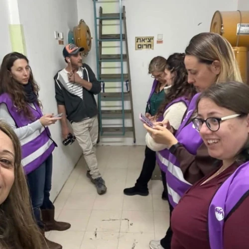 Members of the Purple Vest Mission team take shelter during a siren in a shelter in Kfar Saba, March 2026. Credit: Access Israel.