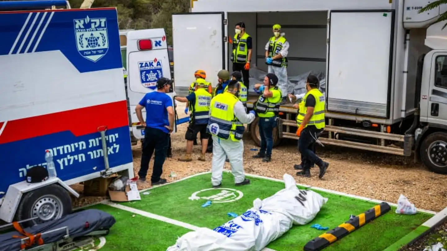 ZAKA emergency response personnel remove the corpses of civilians murdered by Hamas terrorists near Israel's border with Gaza, Oct. 9, 2023. Photo by Yossi Aloni/Flash90.