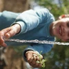A child plays with water, a precious resource in Israel. Credit: Jewish National Fund.