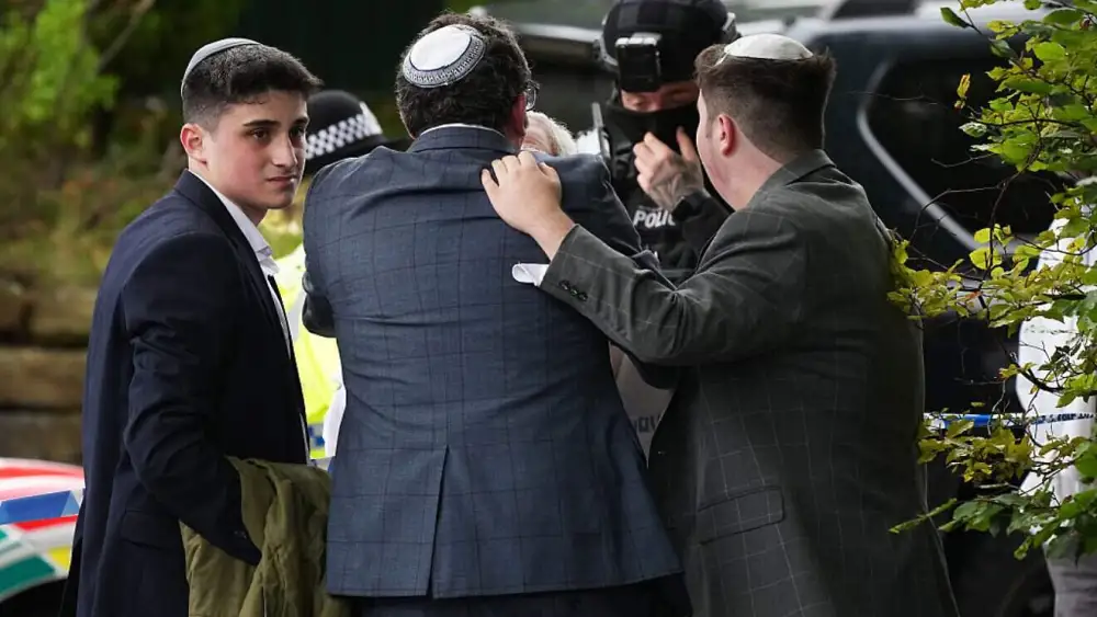 Members of the public, congregants, police and other emergency responders at the Heaton Park Hebrew Congregation in Manchester, England, after a domestic terror attack on Yom Kippur, Oct. 2, 2025. Photo by Christopher Furlong/Getty Images.