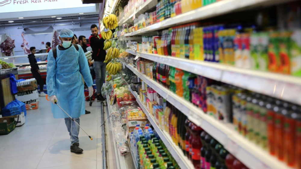 A mall in Gaza City is sprayed with disinfectant as a protective measure against the spread of COVID-19, on March 10, 2020. Photo by Ail Ahmed/Flash90.