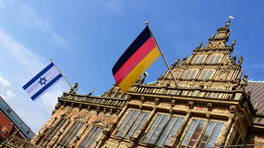 Israeli and German flags flying from the historic city hall in Bremen, Germany. Credit: Harald Schmidt/Shutterstock.