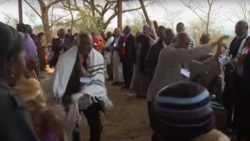 Members of the Lemba tribe dance during a service. Source: Screenshot.