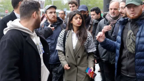 La France Insoumise European Parliament candidate Rima Hassan leaves a rally in Paris on April 30, 2024. Photo by Geoffroy Van der Hasselt/AFP via Getty Images.