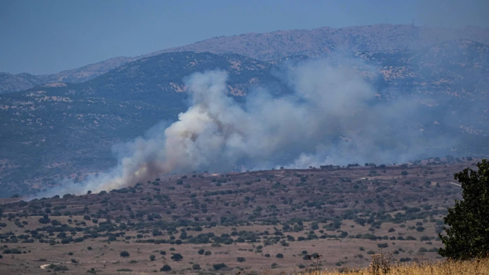 Smoke rises after missiles fired from Lebanon hit open areas in the northern Golan Heights, July 10, 2024. Photo by Ayal Margolin/Flash90.