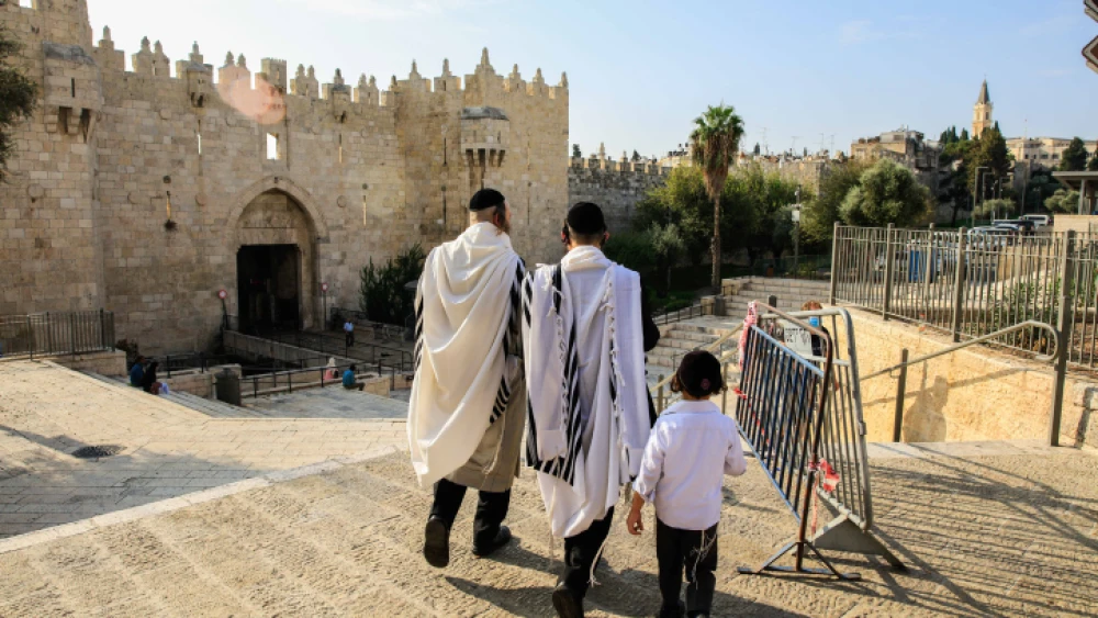 Haredim walk through Damascus Gate in Jerusalem's Old City on Oct. 30, 2020. Photo by Sliman Khader/Flash90.
