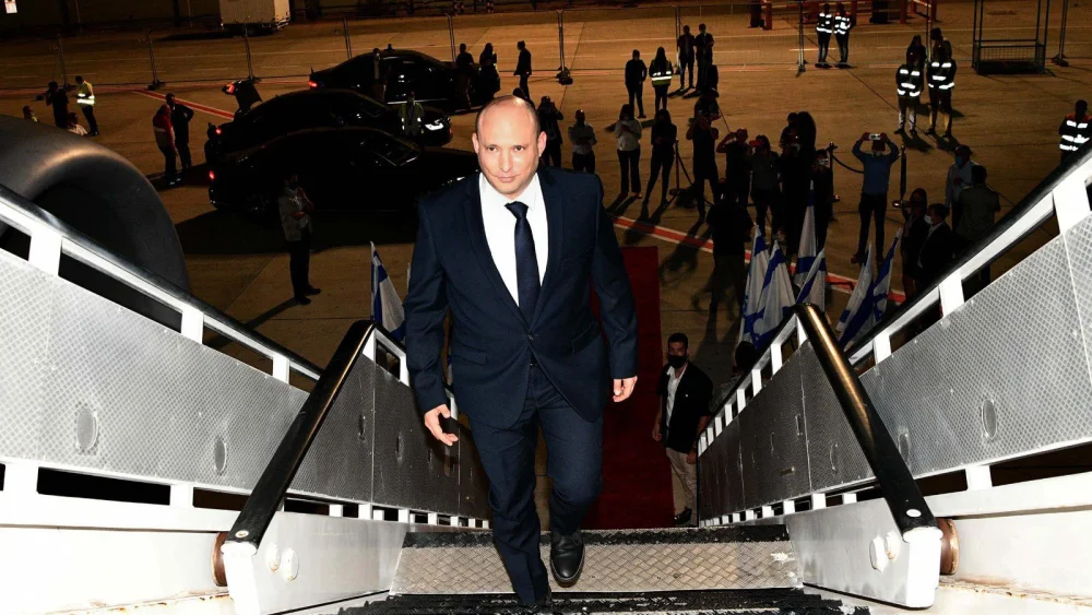 Israeli Prime Minister Naftali Bennett addresses reporters before boarding a plane to New York to address the U.N. General Assembly, Sept. 25, 2021. Photo by Avi Ohayon/GPO.