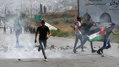 Palestinians hurl stones at Israeli security forces during a demonstration at the Huwara checkpoint, near Nablus, amid Muslim riots over Jerusalem’s Temple Mount holy site July 21, 2017. Photo by Nasser Ishtayeh/Flash90