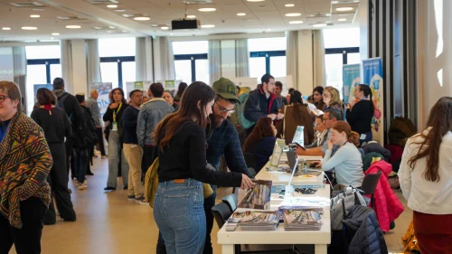 Attendees visiting different tables at the fair. Credit: Courtesy Nefesh B’Nefesh