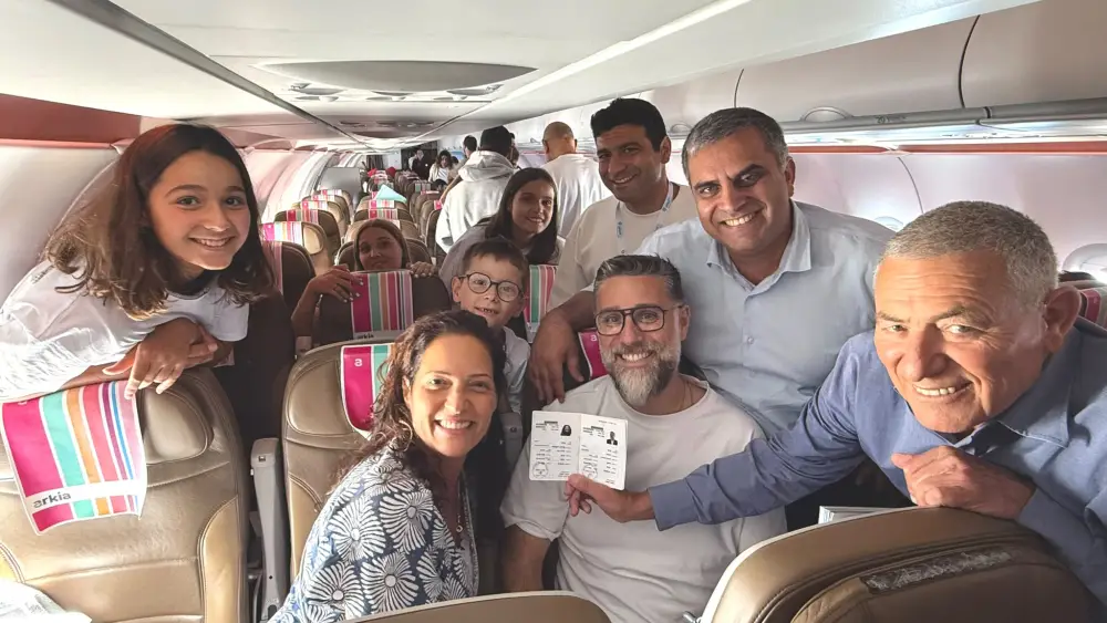 Chairman of The Jewish Agency Doron Almog, Minister of Aliyah and Integration Ofir Sofer and a new olim family from France