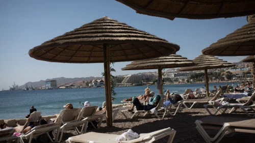Visitors and tourists at the beach in the southern Israeli city of Eilat, on Jan. 5, 2019. Credit: Hadas Parush/Flash90.