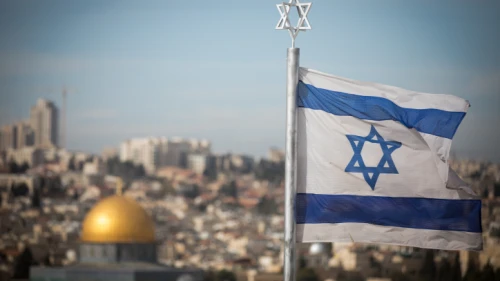 An Israeli flag waves in front of the Temple Mount, Dec. 5, 2017. Photo by Yonatan Sindel/Flash90.