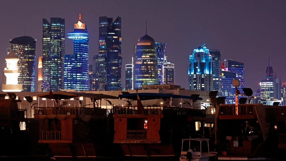 Illuminated skyscrapers are pictured along the Corniche promenade in Doha, June 29, 2026. Photo by Karim Jaafar/AFP via Getty Images.
