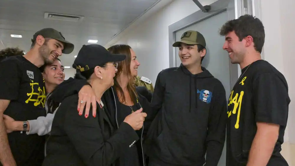 IDF Staff Sgt. Edan Alexander embraces family members during an emotional reunion at Tel Aviv Sourasky Medical Center on May 12, 2025. Photo by Kobi Gideon/GPO.