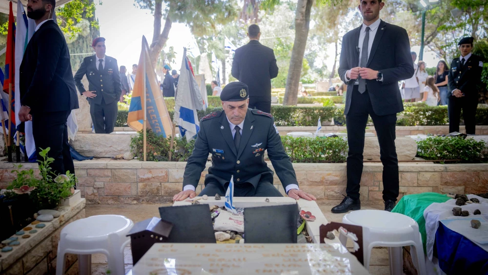 IDF Chief of Staff Lt. Gen. Eyal Zamir lays an Israeli flag on the grave of the last Israeli soldier who was buried, at Mount Herzl military cemetery in Jerusalem on April 28, 2025. Photo by Chaim Goldberg/Flash90.