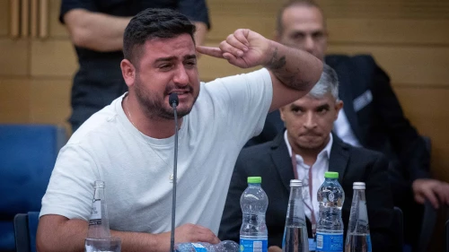 A man cries during an emergency meeting of the lobby for aid to IDF veterans with PTSD and their families at the Knesset in Jerusalem on Aug. 8, 2023. Photo by Oren Ben Hakoon/Flash90.