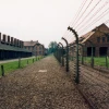 The site of the former Auschwitz concentration camp in Poland. A controversial new law passed by Poland's parliament is rooted in Polish resentment when Auschwitz and other Nazi German concentration camps are referred to as “Polish death camps.” Credit: Giraud Patrick via Wikimedia Commons.